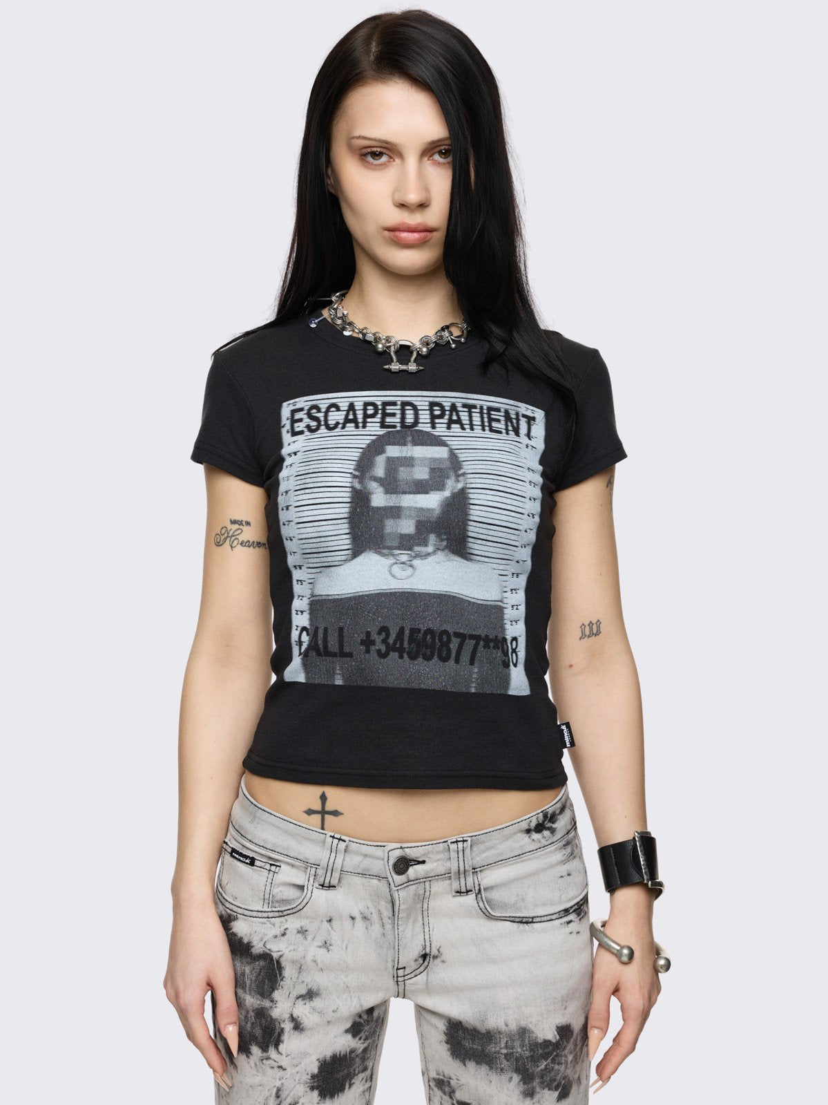 Black baby tee with mugshot graphic front print. 