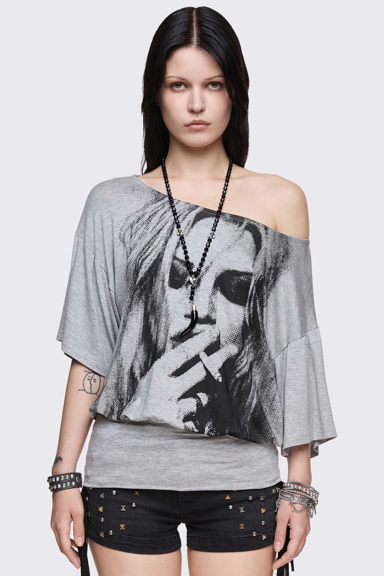 Gray marl off-shoulder top with smoking girl graphic, asymmetrical neckline and grunge vibe.
