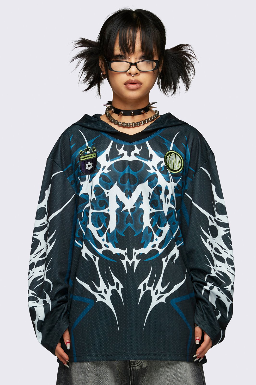 Football jersey hoodie in black with tribal graphic print in white and blue