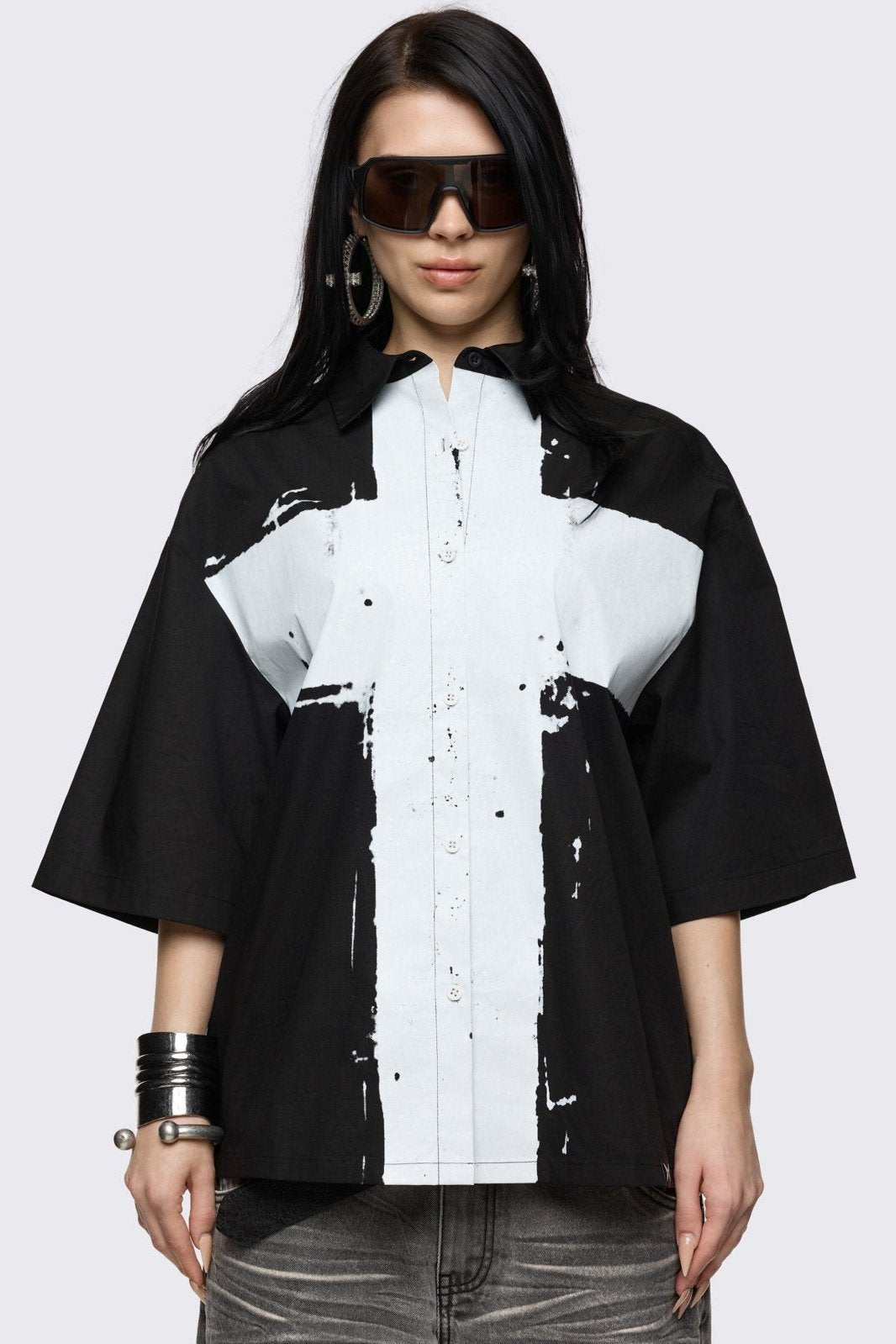 Black short sleeve with chunky white cross print.