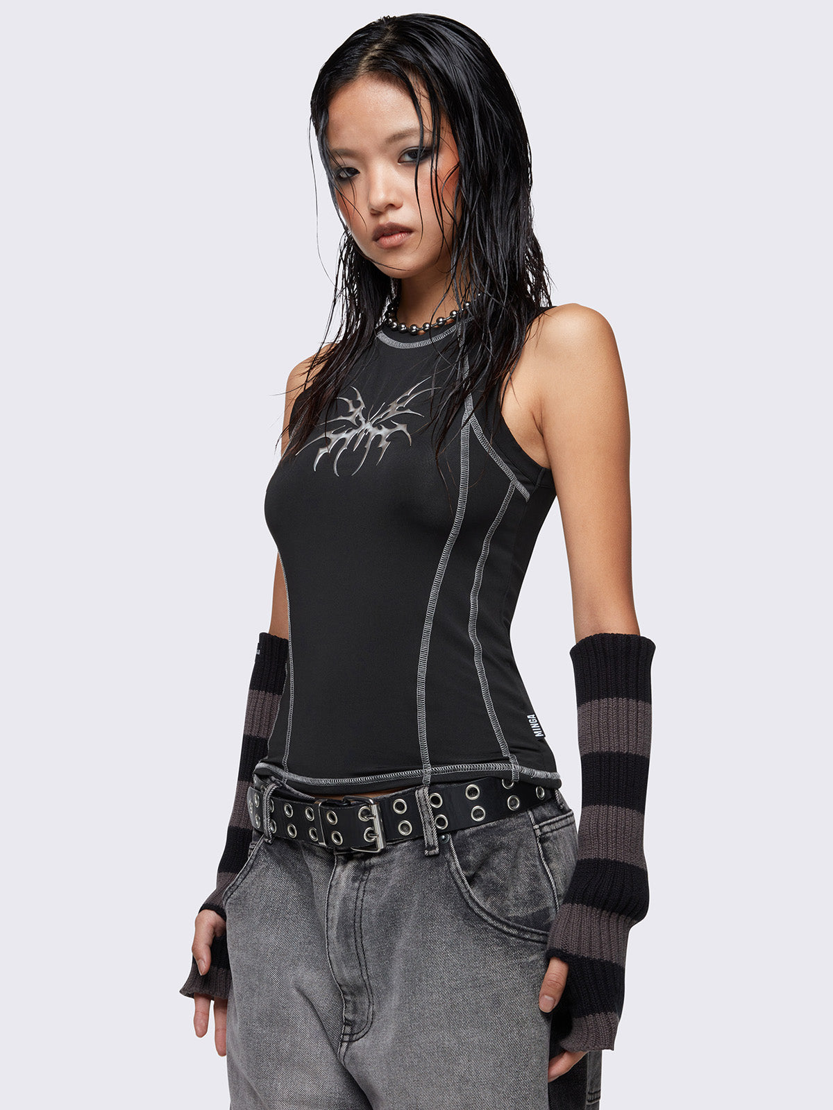 Tank top in black featuring contrast stitching in off white and butterfly metal embossed front print. 