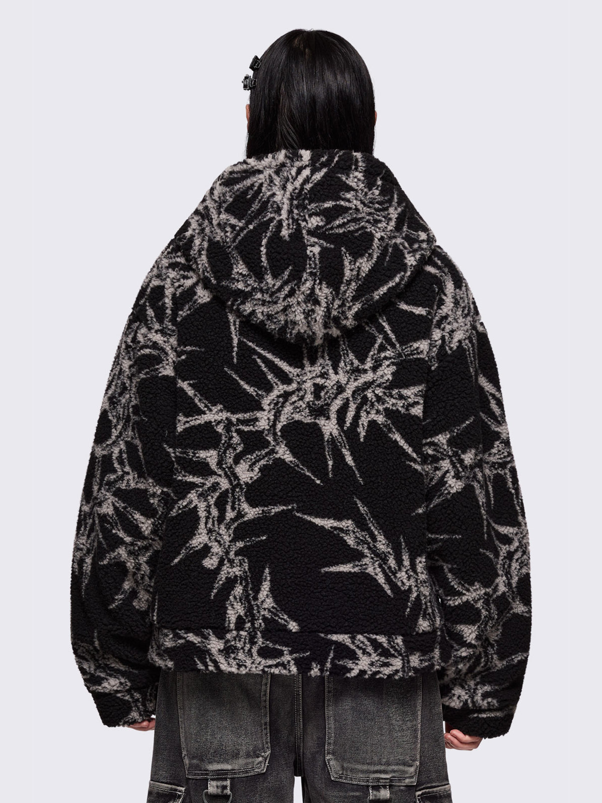 Black fleece borg hoodie jacket with all over grey thorns design.
