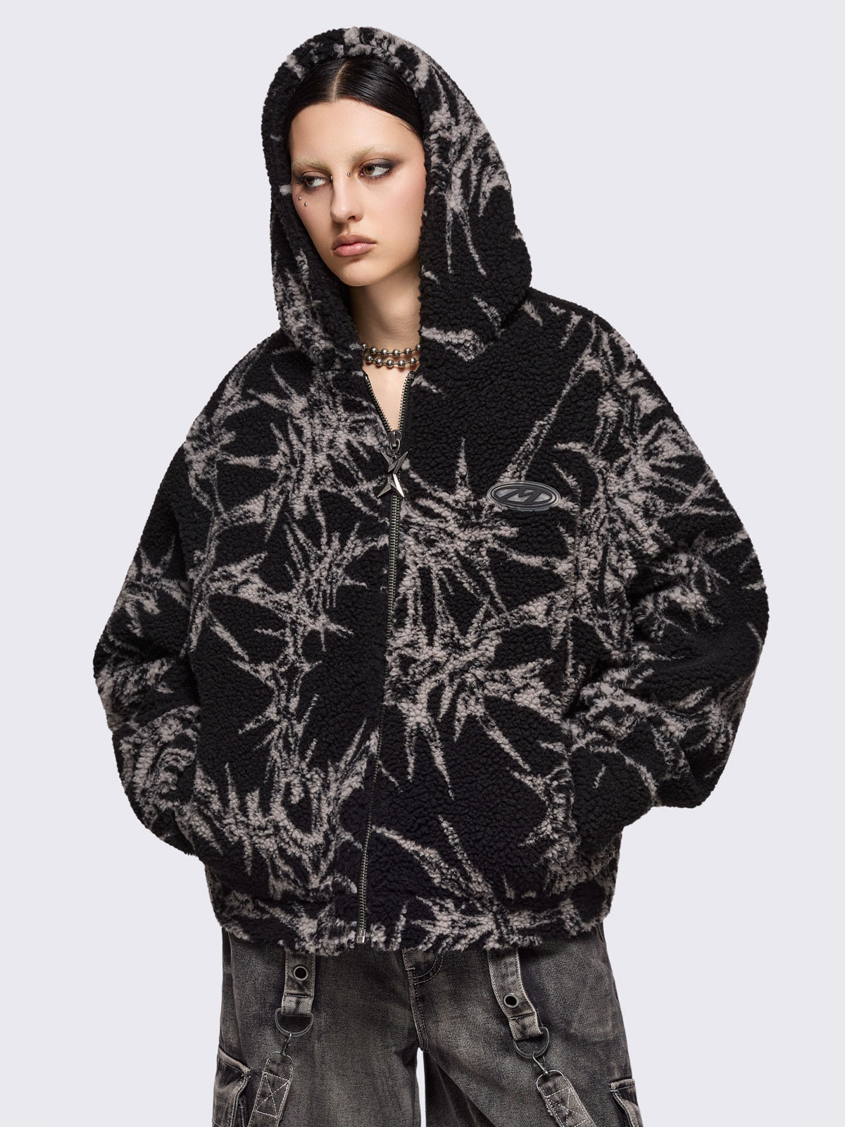 Black fleece borg hoodie jacket with all over grey thorns design.