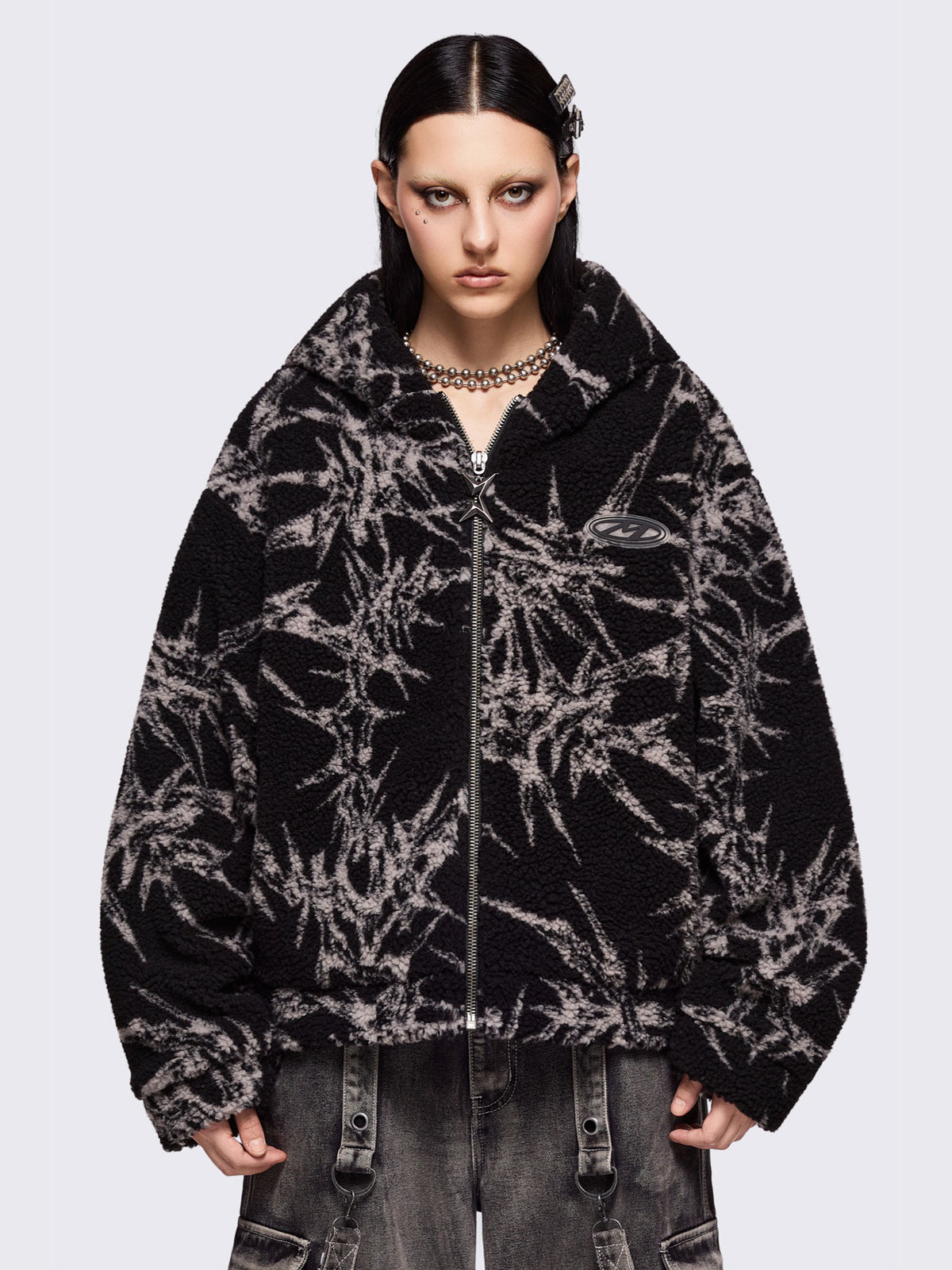 Black fleece borg hoodie jacket with all over grey thorns design.