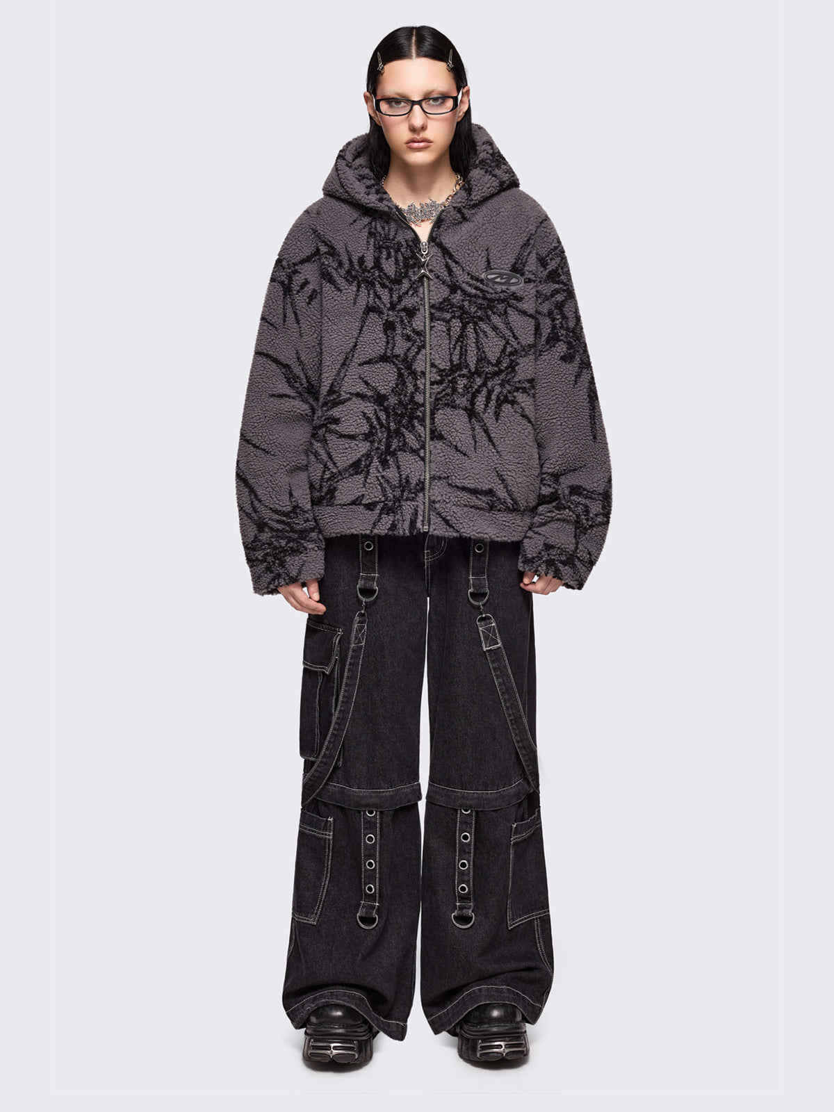 Grey fleece hoodie jacket featuring all over black thorns design.