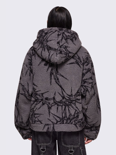 Grey fleece hoodie jacket featuring all over black thorns design.