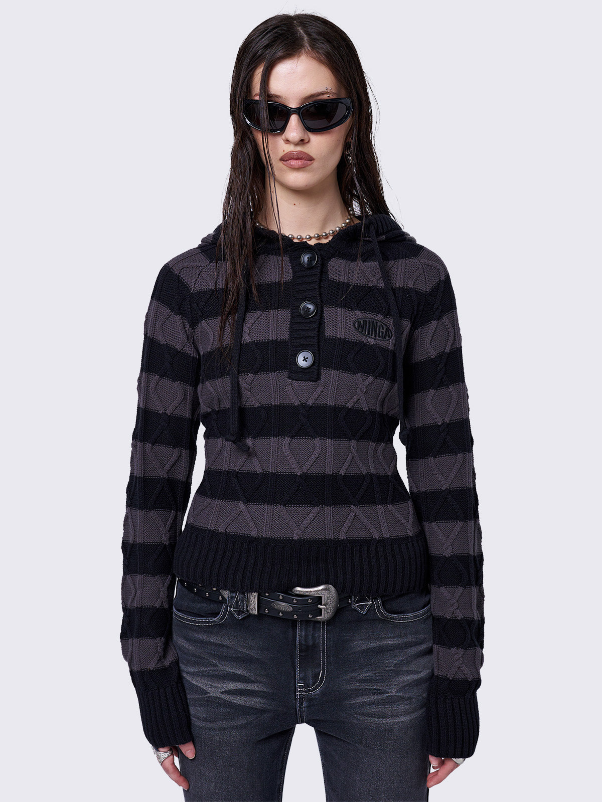 Cable-knit hooded jumper with grey and black stripes, featuring a half-button placket for added detail.