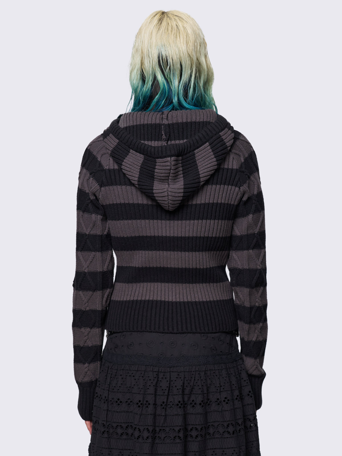 Cable-knit hooded jumper with grey and black stripes, featuring a half-button placket for added detail.