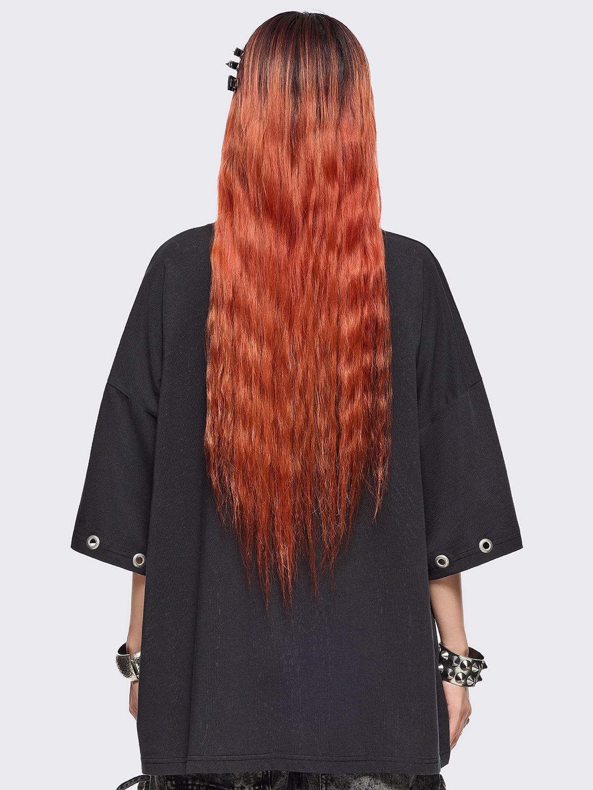 Black oversized t-shirt with anime girl graphic front print and silver eyelets trims.