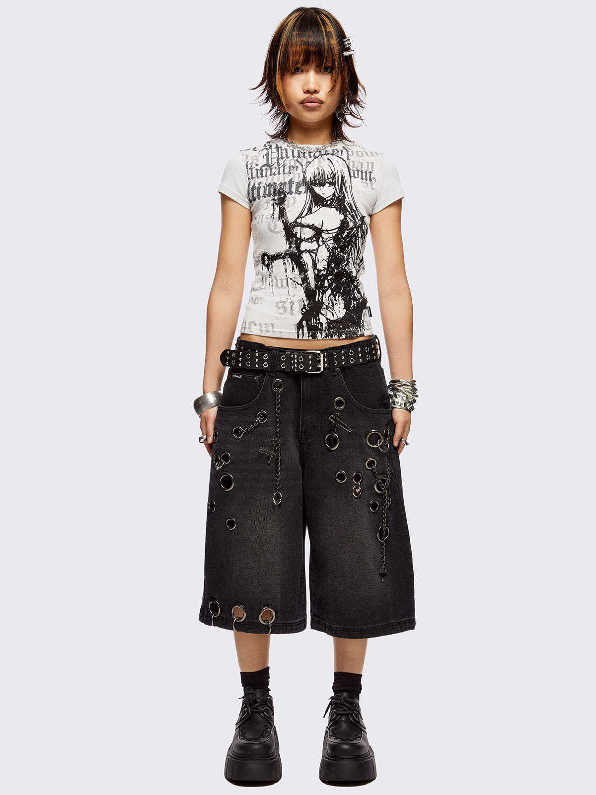 Black washed longline denim shorts with eyelets, chains, safety pins and more metal hardware details. Streetwear, grunge and y2k vibes.