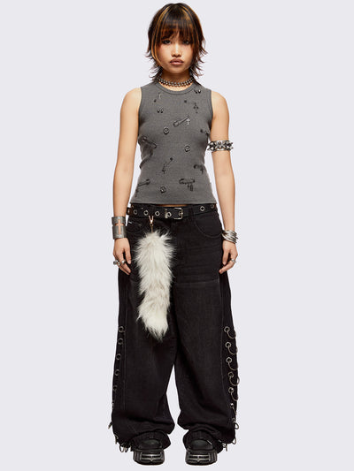 Sleeveless grey tank top with safety pins and piercing details. Grunge-style vibes. 