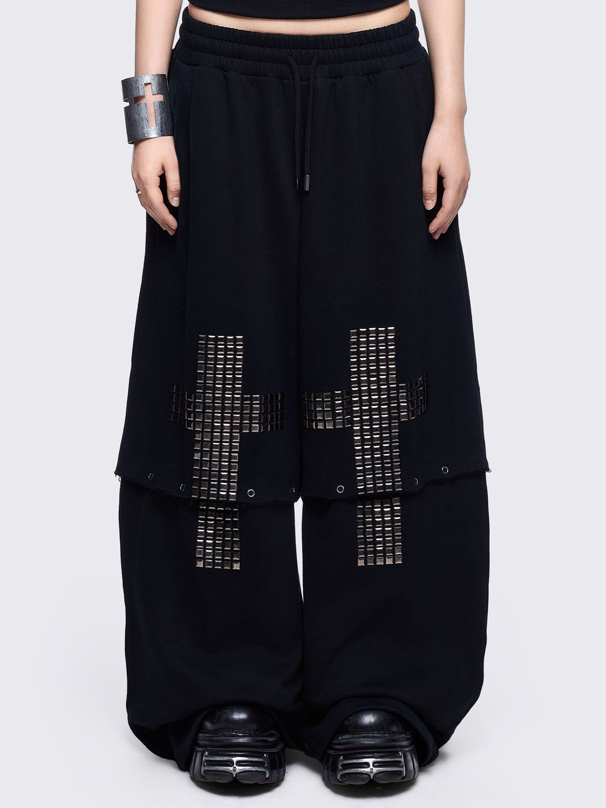 Black sweatpants with silver studded cross, "Reverse" patch back and detachable-leg .