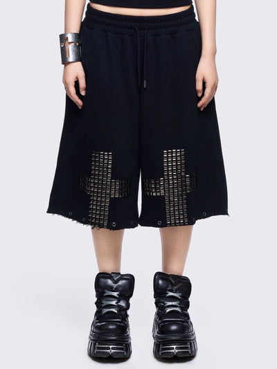 Black sweatpants with silver studded cross, "Reverse" patch back and detachable-leg .