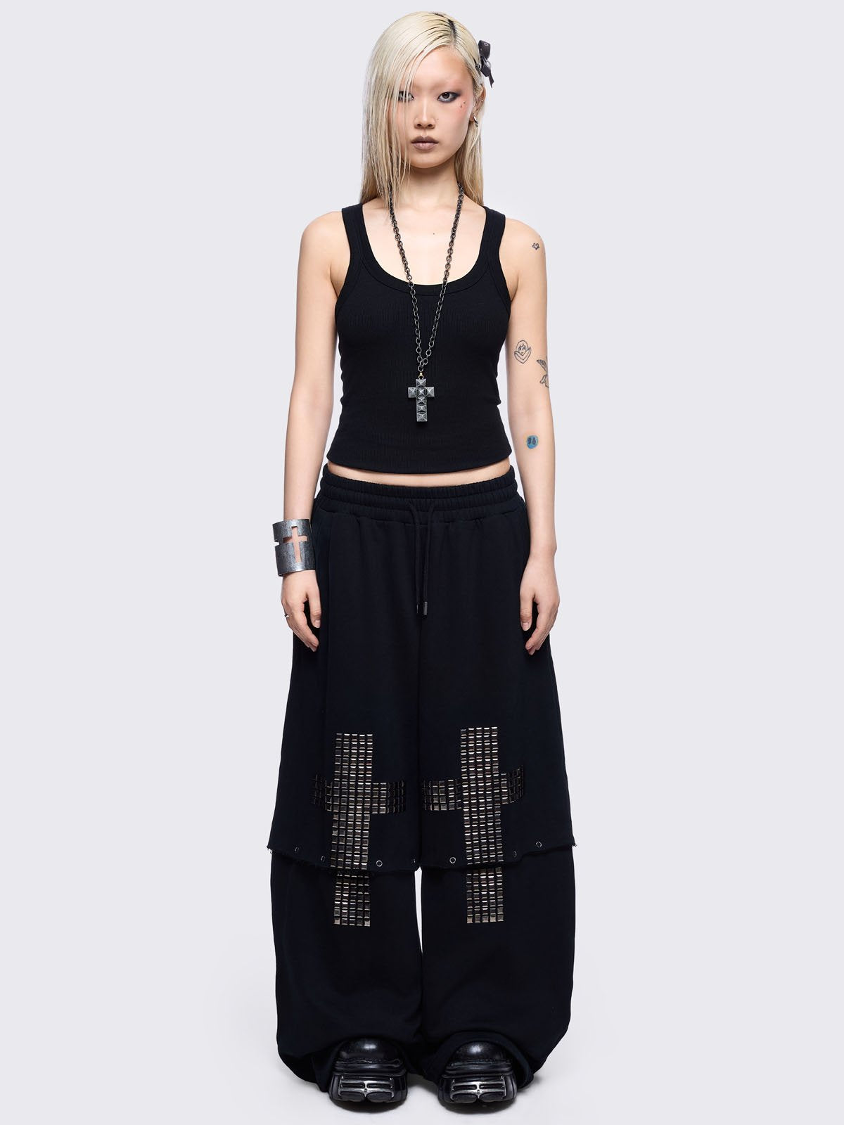 Black sweatpants with silver studded cross, "Reverse" patch back and detachable-leg .