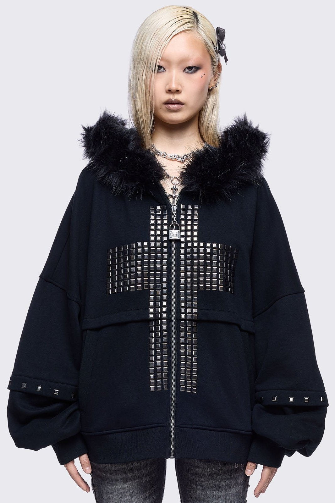 Black zip up hoodie jacket with faux fur hood with silver studded cross.