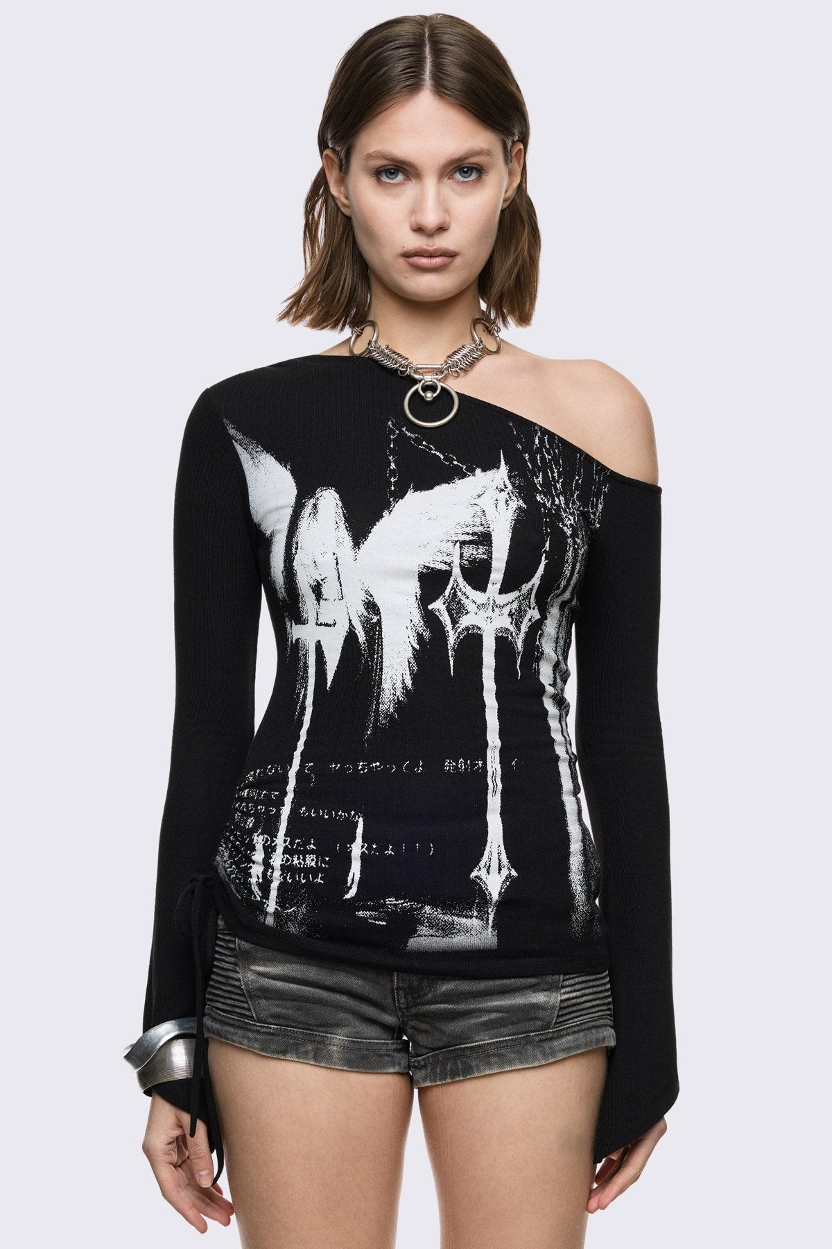 Black off-shoulder top with white wing and cross graphic, ruched side and goth vibe.