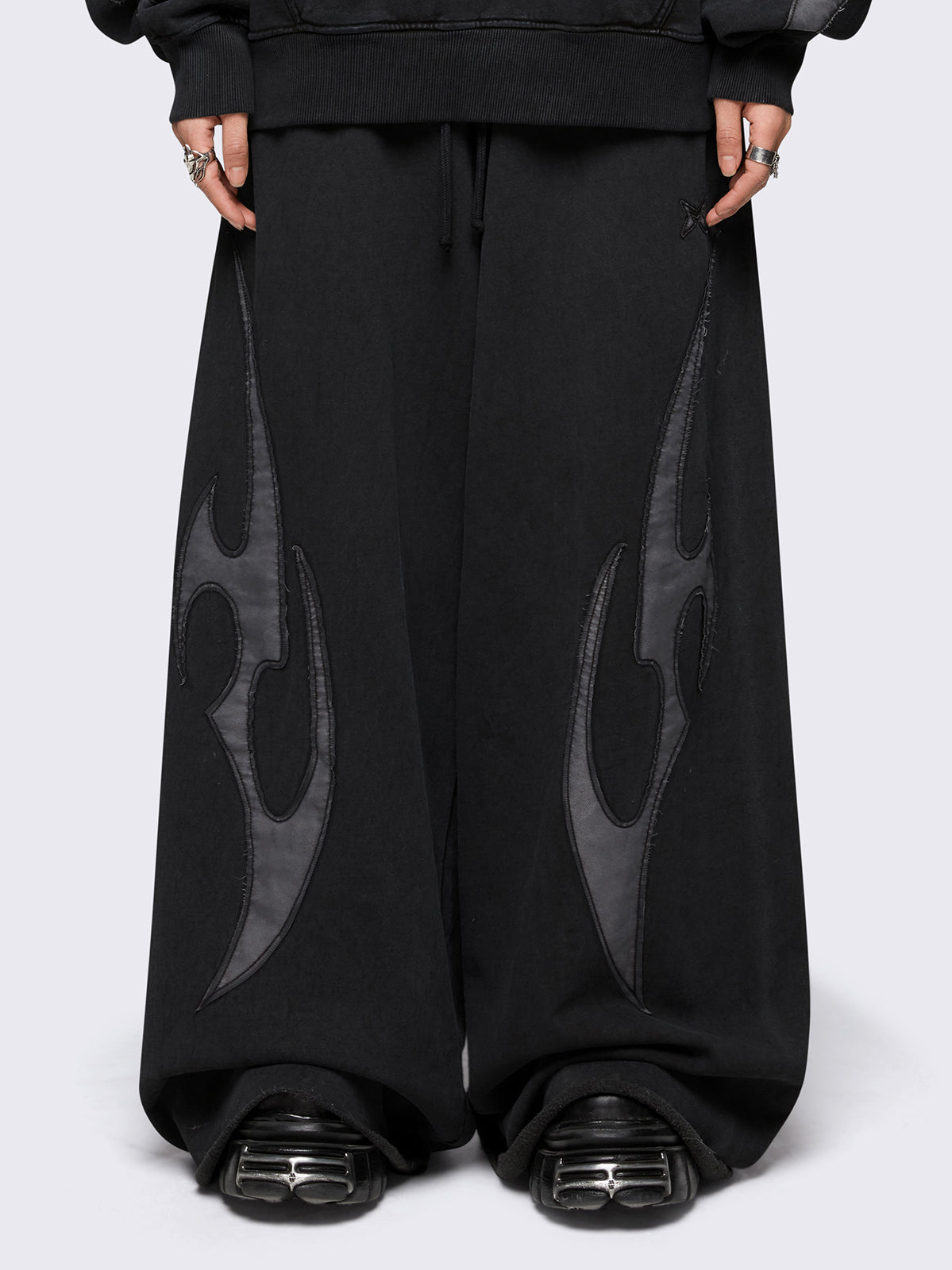 Black washed wide leg sweatpants with grey sigilism patches.