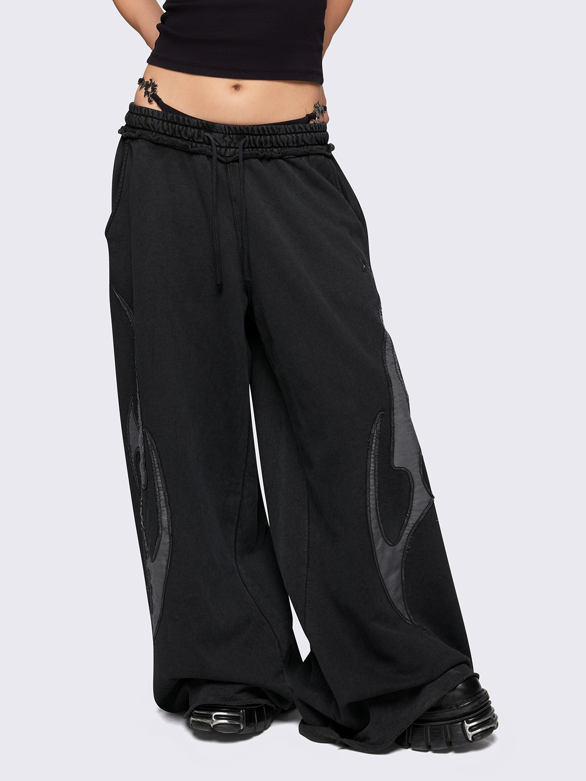 Black washed wide leg sweatpants with grey sigilism patches.