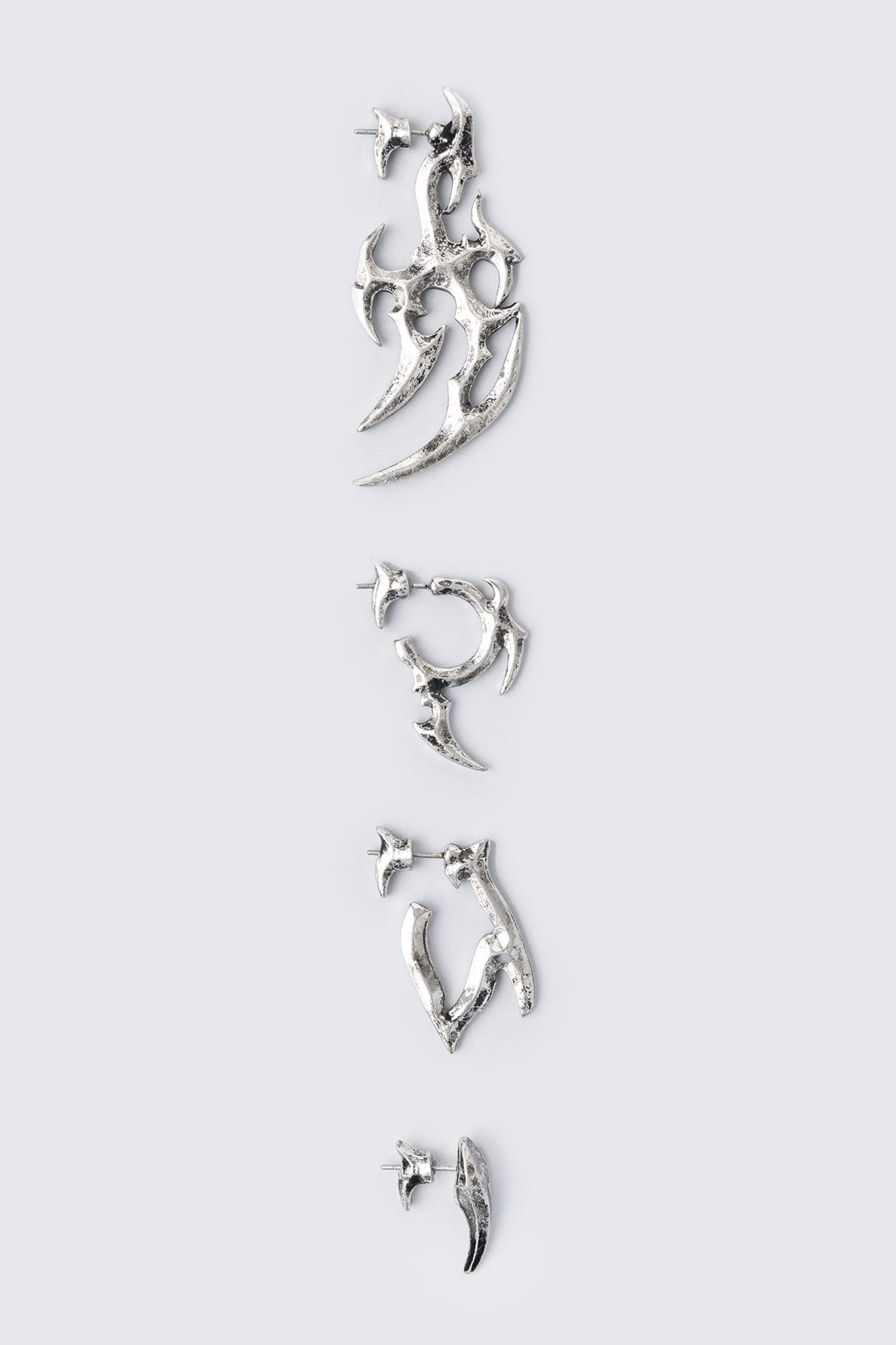Silver 4pc chunky earring set in sigilism design.