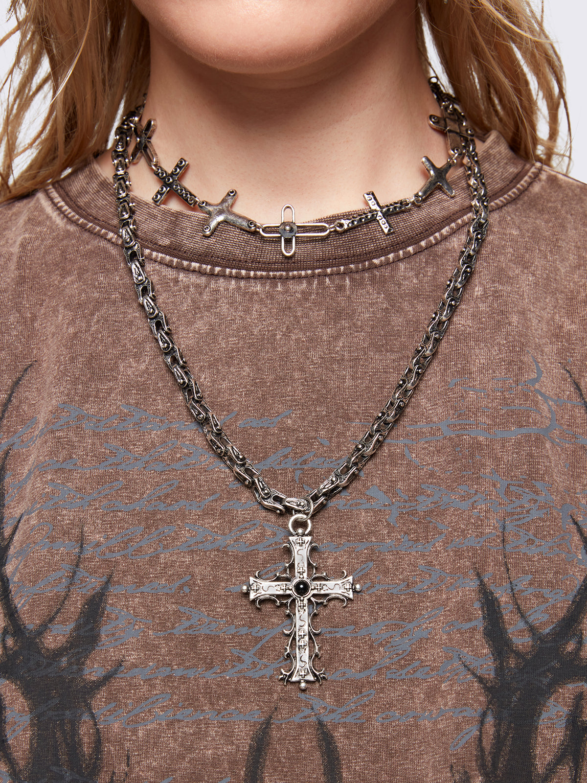 Set of 2 silver necklaces: one chunky chain with a bold cross pendant and another sturdy chain featuring multiple cross charms.