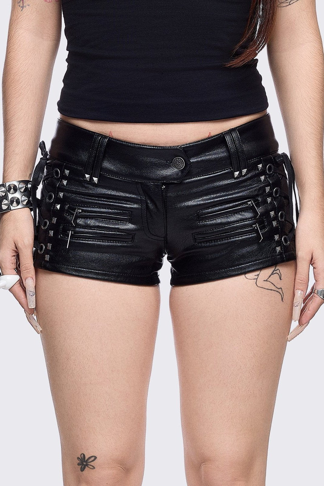 Black vegan leather hot pants with lace-ups and silver stud details