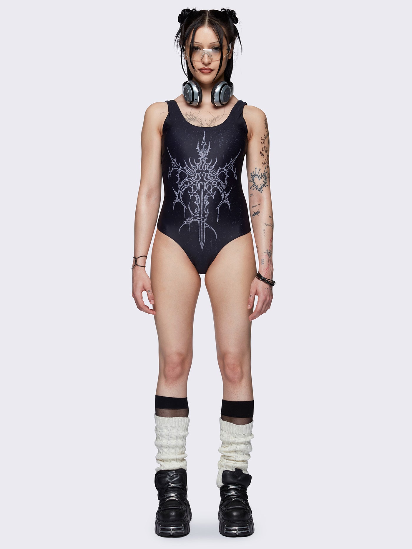 One-piece swimsuit in black with dagger graphic print