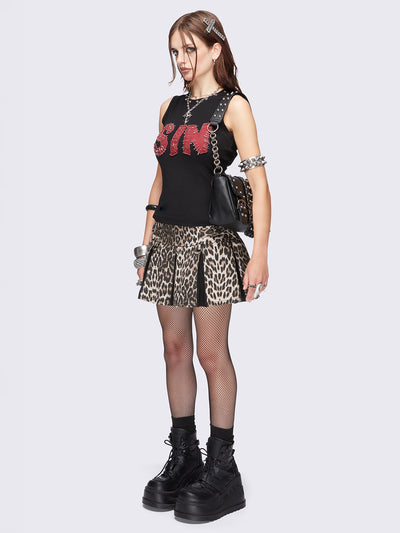 Black vest top featuring a "SIN" red patch with safety pins and studded trim details. 