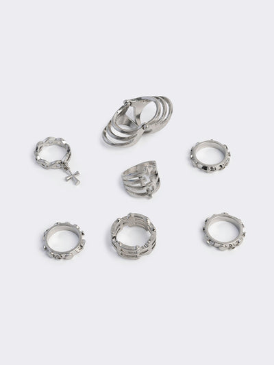 Silver set of 4 rings with cross designs.