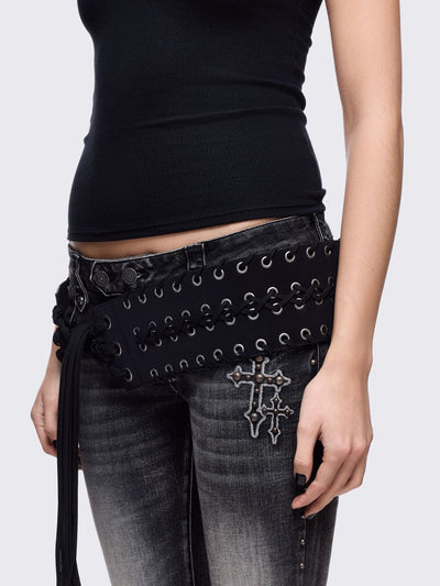 Black faux leather wide belt with silver eyelet, lace-up details and long tassel fringe