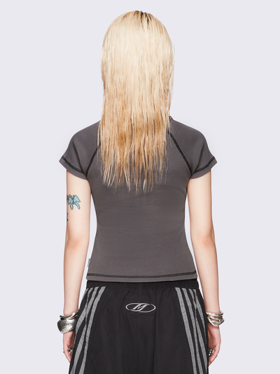 Grey graphic baby tee with tribal sun and thorns print and black contrast stitching.