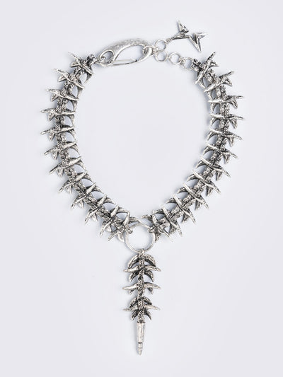 Silver chunky charm necklace featuring a spine design and spike pendant.