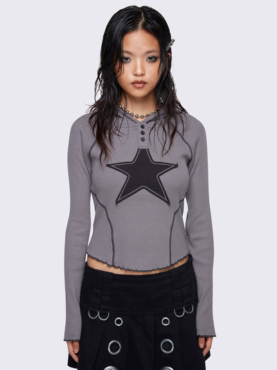 Hooded top in grey, with front star patch in black, contrast stitching in black and half button placket