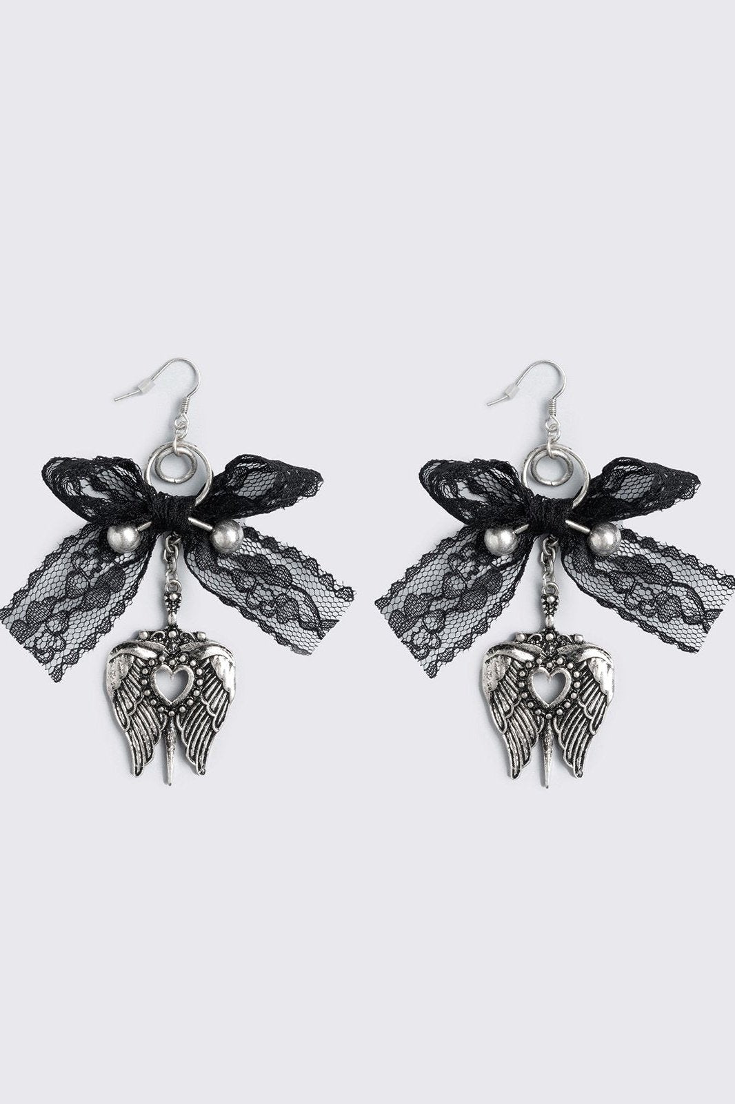 Silver dangle earrings with winged heart pendant and back lace bows and piercing details.