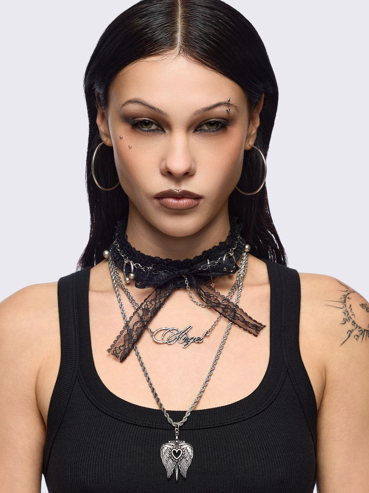 Set of 3 necklaces, black lace bow choker with piercings and chain  and "Angel" tag and winged heart pendants.