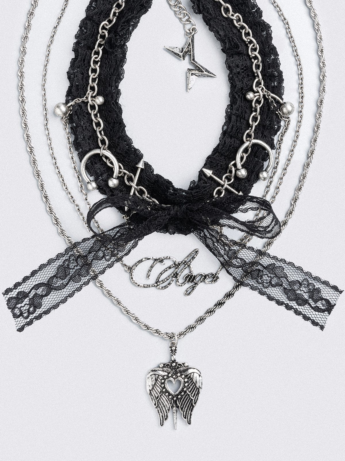Set of 3 necklaces, black lace bow choker with piercings and chain  and "Angel" tag and winged heart pendants.