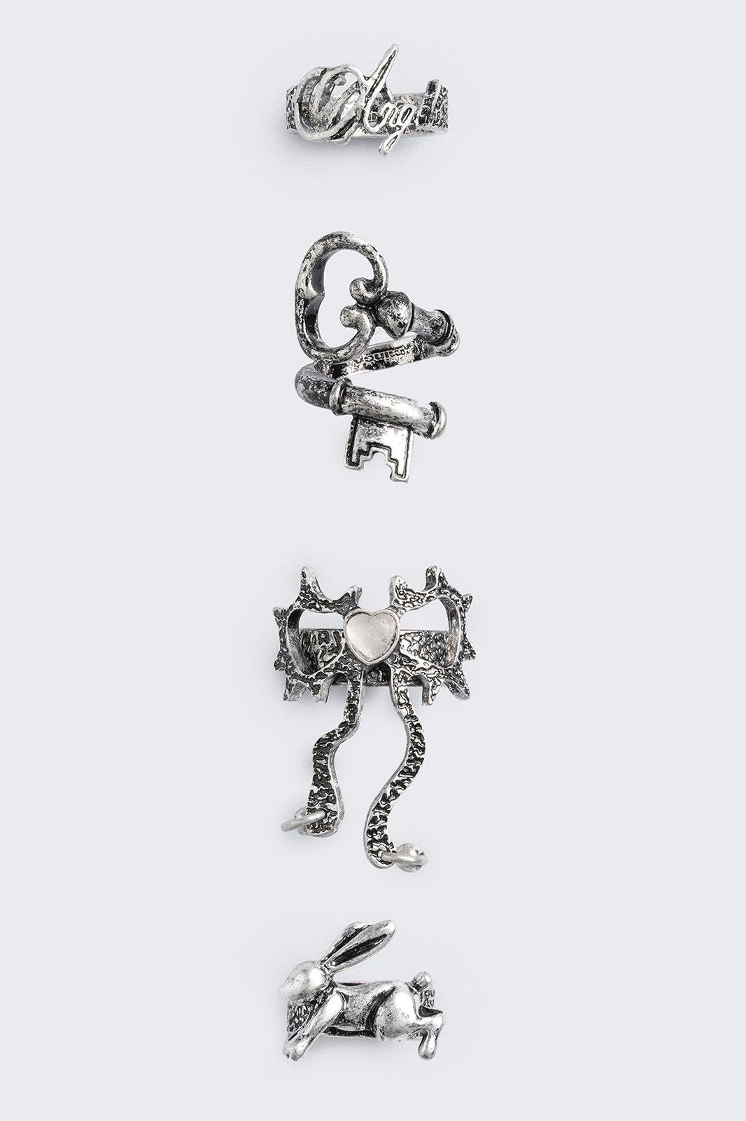 Set of 4 silver rings: Bunny, "angel", heart bow and key designs.