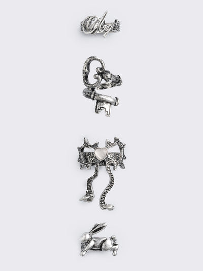 Set of 4 silver rings: Bunny, "angel", heart bow and key designs.