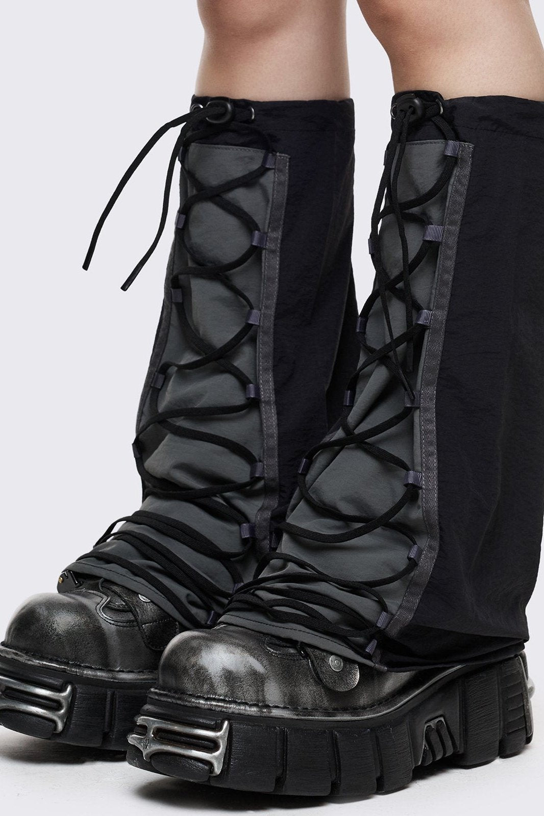 Black tech flared leg warmers with grey panel with lace-up and adjustable toggle