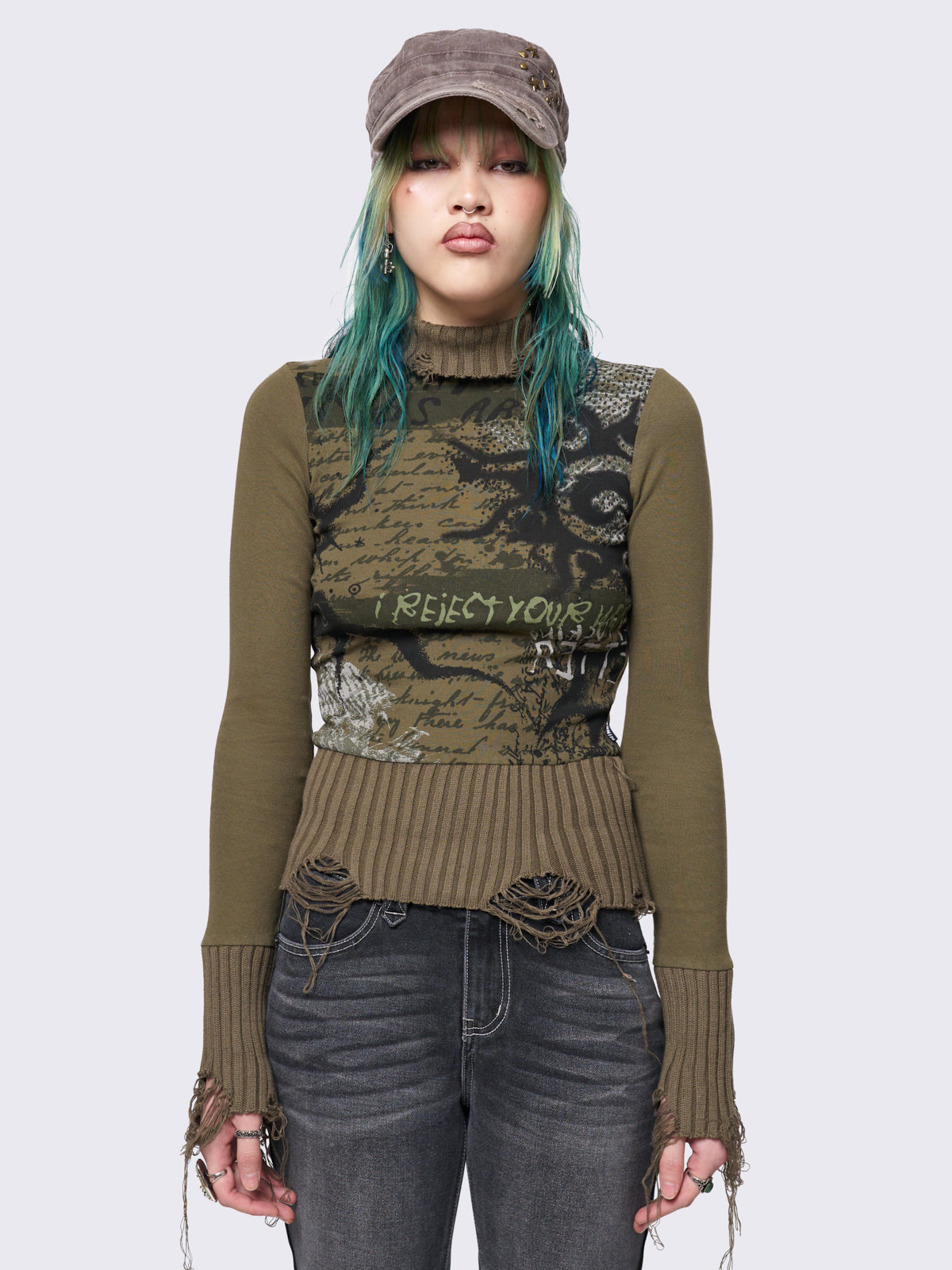 Khaki high-neck long sleeve top with a grunge graphic print on the front, featuring distressed chunky ribbed trims.