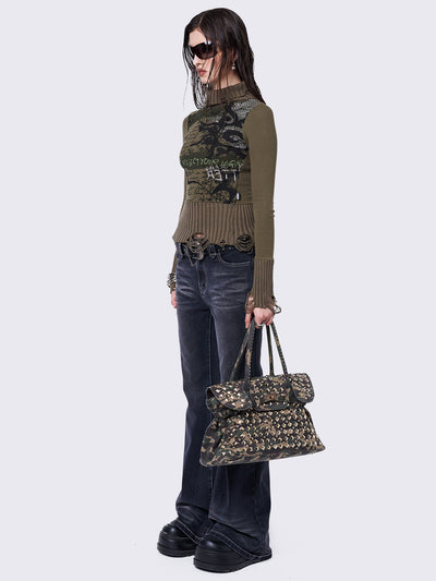 Khaki high-neck long sleeve top with a grunge graphic print on the front, featuring distressed chunky ribbed trims.