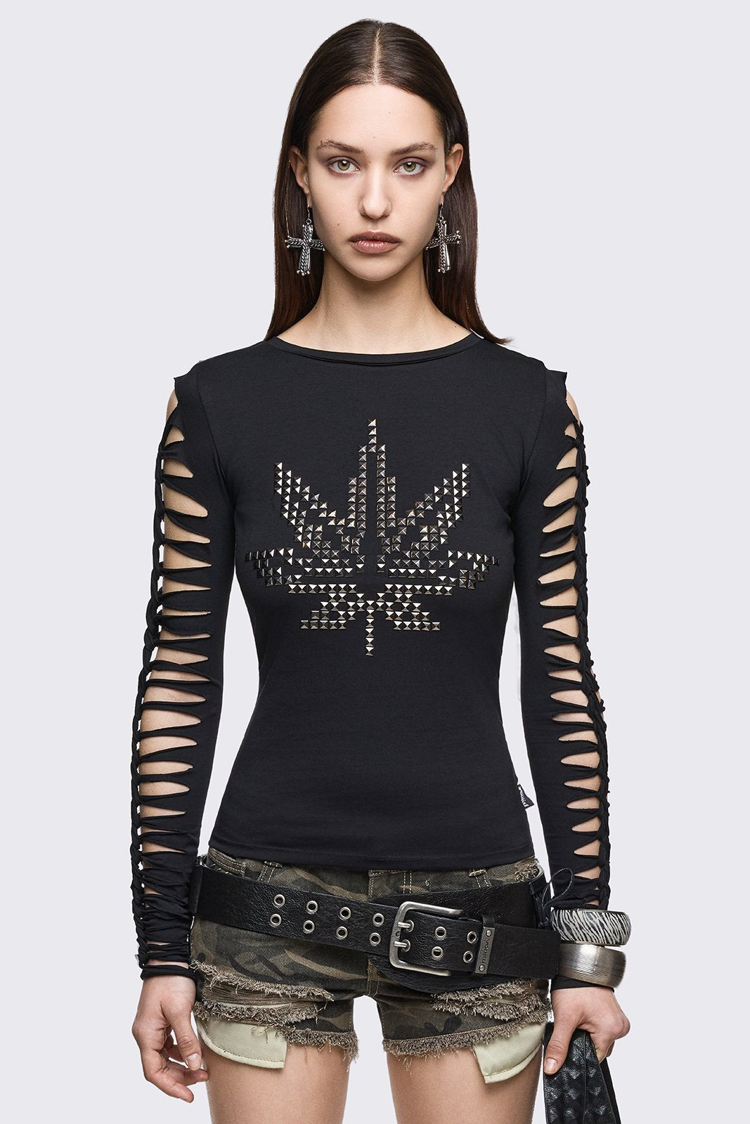 Black cotton long sleeve top with silver studded leaf motif and slashed cut-out sleeves in a grunge Y2K style.