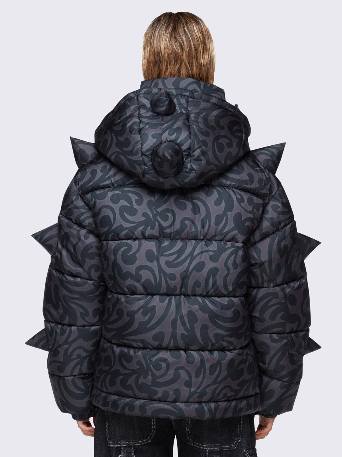 Hooded puffer jacket in grey with tribal print all over in black and 3D spikes