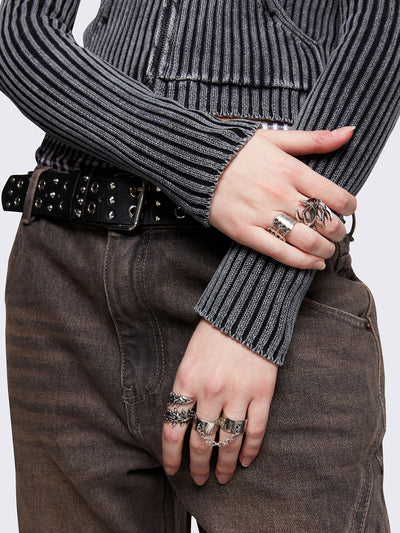 Set of 6 silver rings featuring a corset, spikes, thorns and chain designs. Slim and chunky bands styles. 