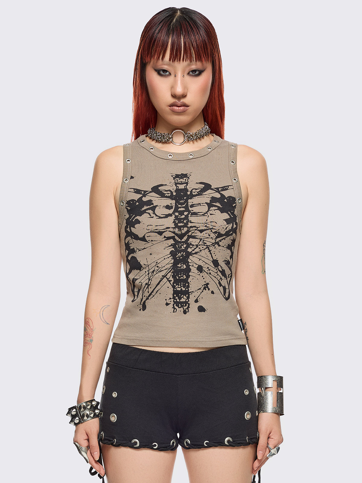 Stone tank top with black skeleton graphic front print and eyelet trim details.