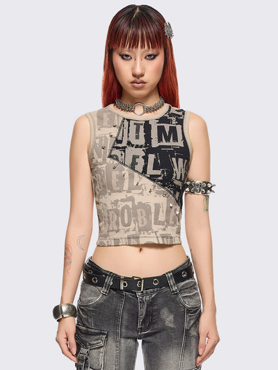 Beige and black patchwork tank top with grunge graphic front print in contrast featuring safety pin details and black contrast stitching.