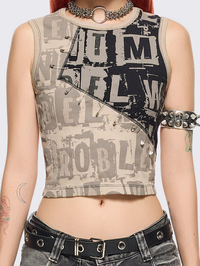 Beige and black patchwork tank top with grunge graphic front print in contrast featuring safety pin details and black contrast stitching.