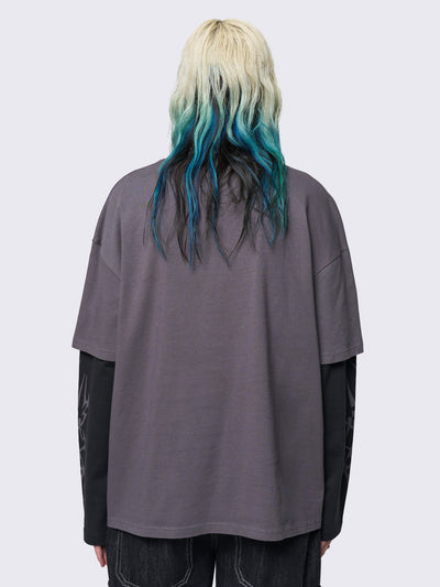 Layered long sleeve t-shirt in grey with contrast sleeves in black and sigilism graphic front and sleeves.