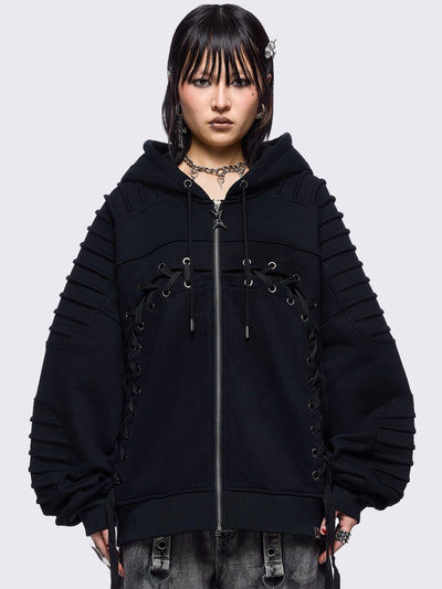 Black zip up hoodie jacket featuring a moto pintuck panels and front lace corset details. 