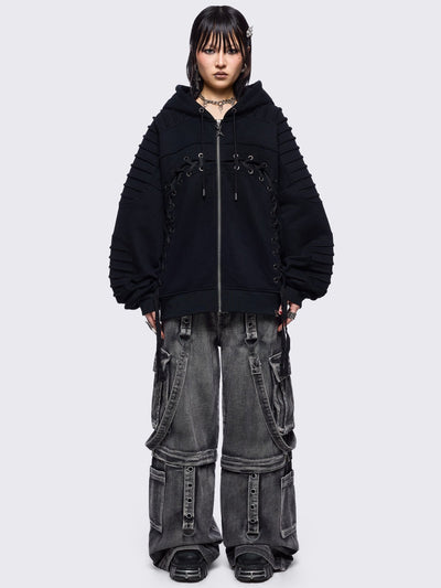 Black zip up hoodie jacket featuring a moto pintuck panels and front lace corset details. 