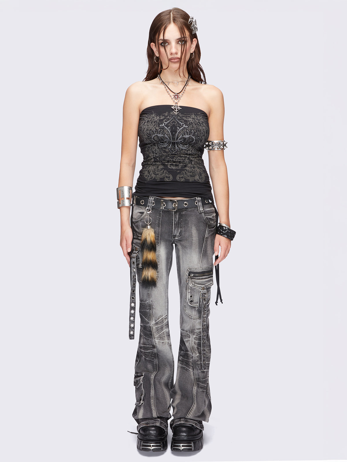 Black bandeau tube top with grunge graphic print, stud details and ruched tie side detail.